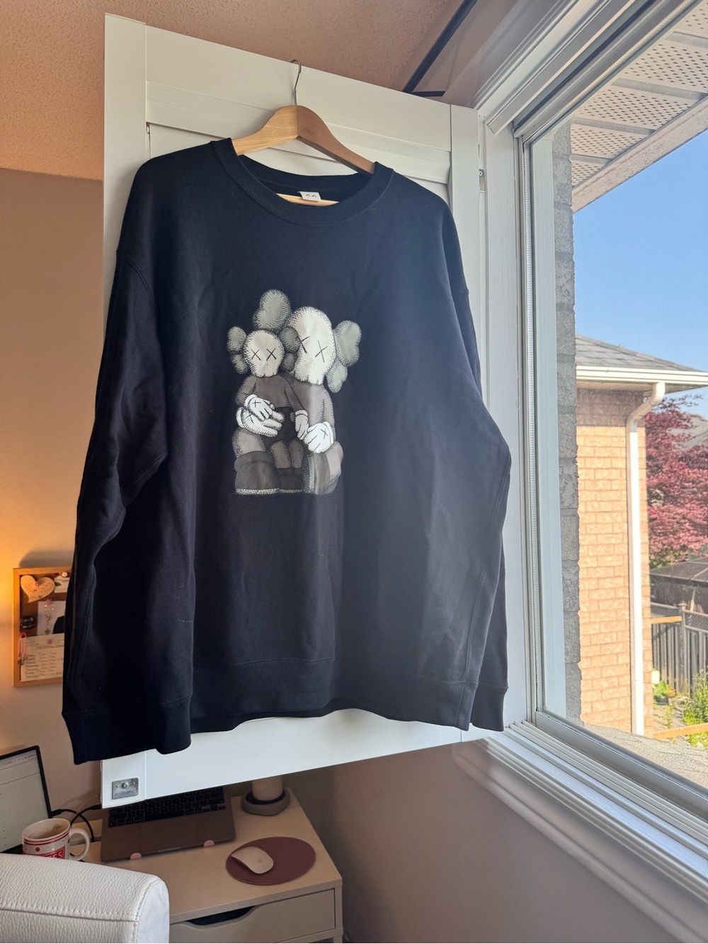 Uniqlo Black Crewneck Sweatshirt with Gray & White KAWS-Style Graphic